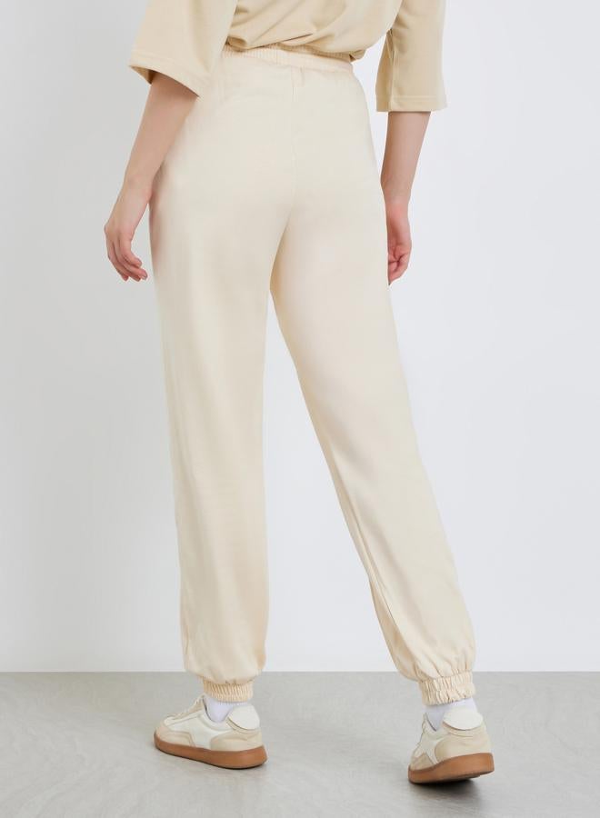 Styli Women Beige Tapered Joggers with Drawstring - Image 3